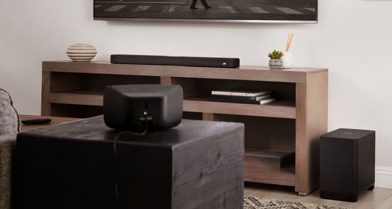 Several audio components spread around a living room. Several audio components spread around a living room.